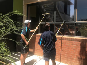 Cleaning school windows from outside